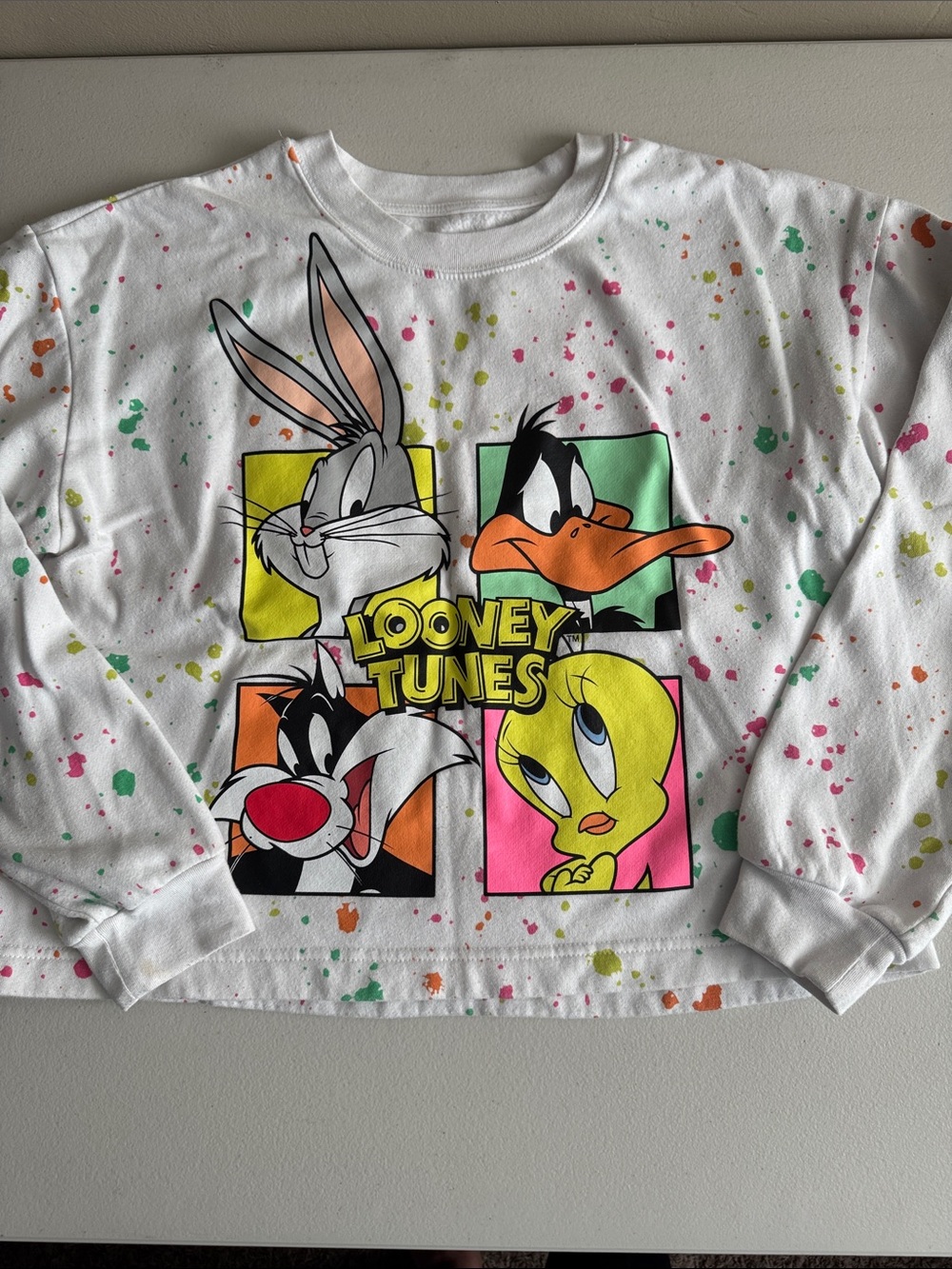 Warner Bros. White Looney Tunes Graphic Sweatshirt with Neon Splatter